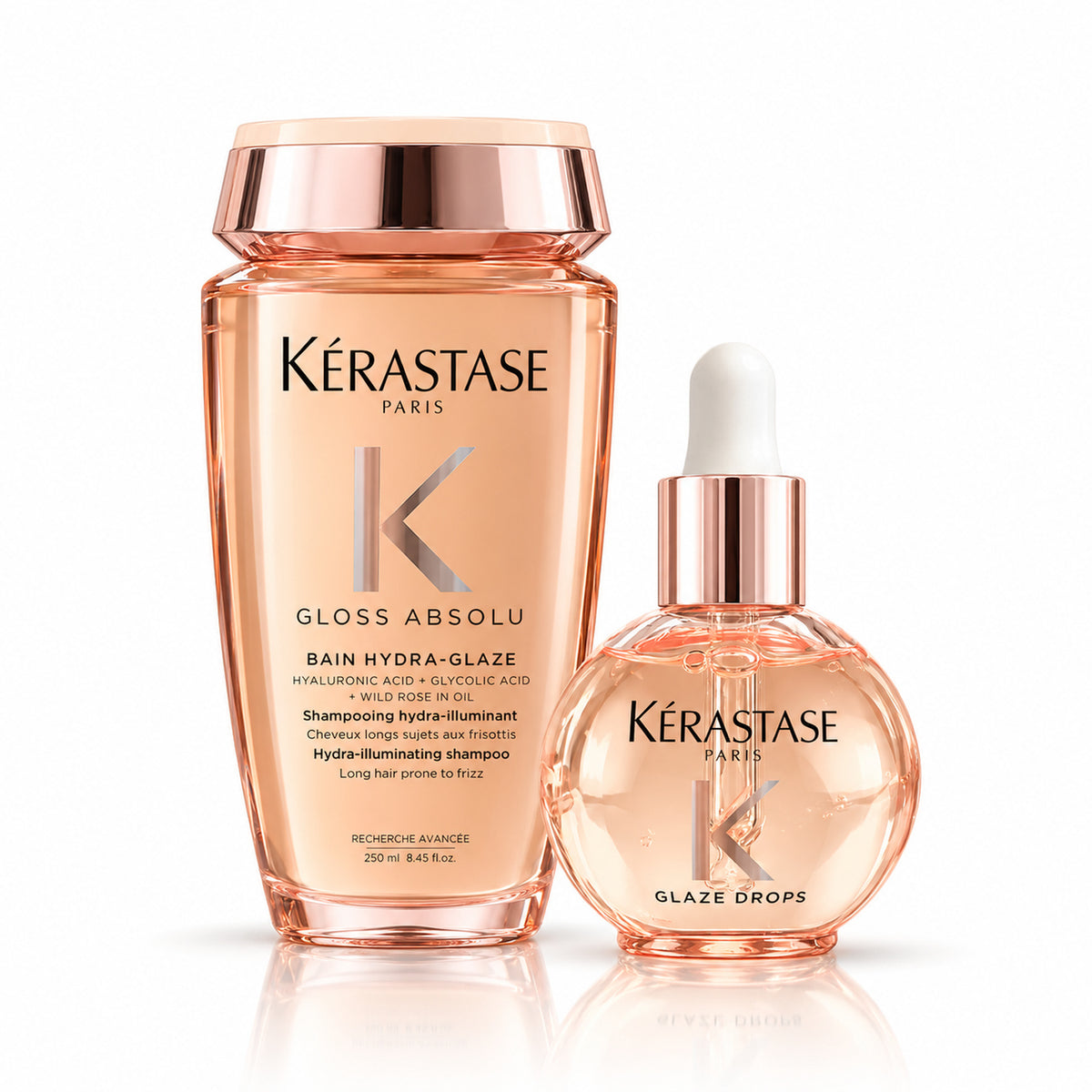 Dúo Kérastase Gloss Absolu sobre fondo blanco con shampoo Bain Hydra-Glaze 250 ml y aceite Glaze Drops 45 ml.