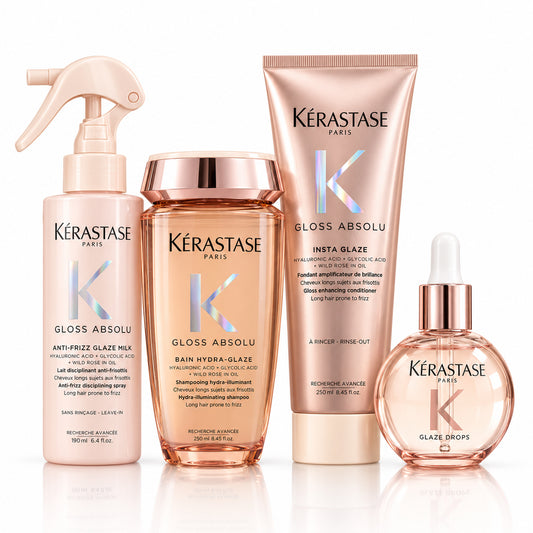 Pack Kérastase Gloss Absolu sobre fondo blanco: shampoo Hydra-Glaze, acondicionador Insta Glaze, spray Glaze Milk y aceite Glaze Drops.